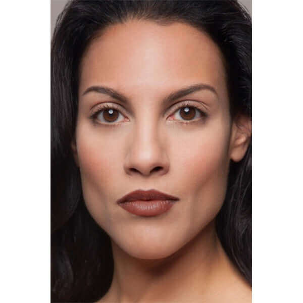 Buzzed Plush Rush Lipstick (warm cocoa crème) on mixed ethnicity model